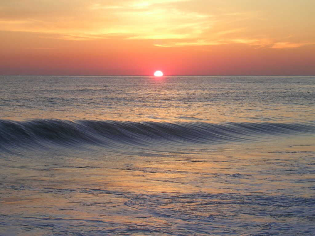 Finding peace at sunrise by the ocean, a picture of calm and God's presence